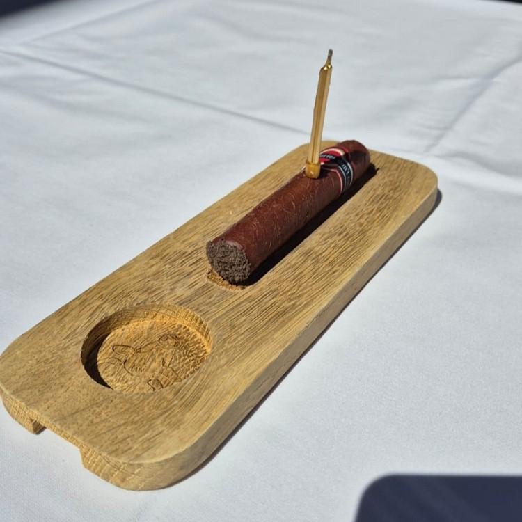 The signature birthday cigar dessert at Pimiento Argentino Grill, Kraków